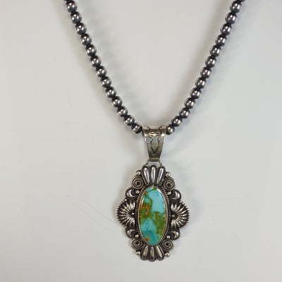 Royston Turquoise Pendant by Silversmith, Derrick Gordon