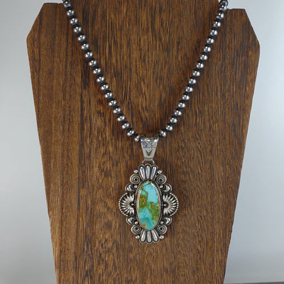 Royston Turquoise Pendant by Silversmith, Derrick Gordon